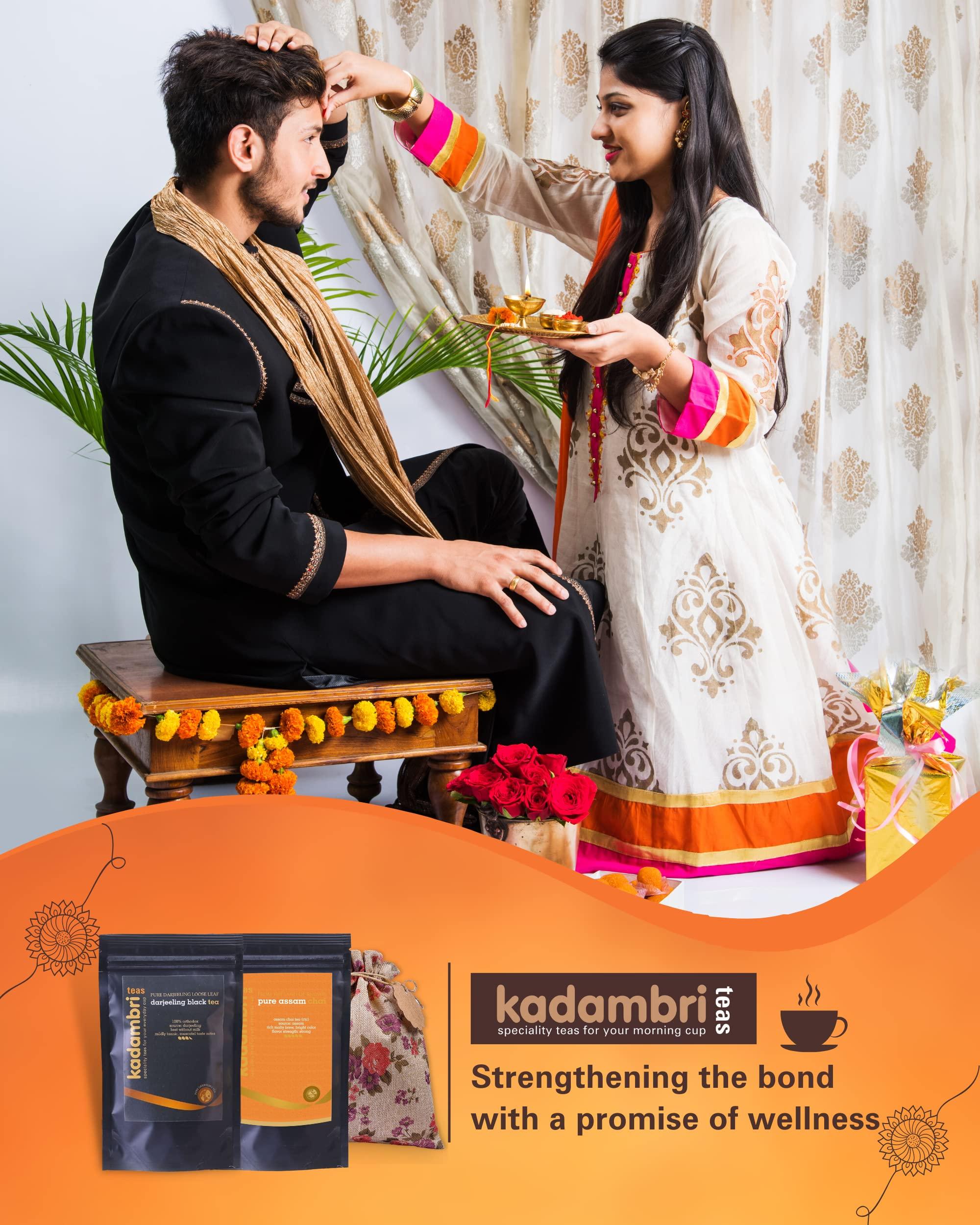 Kadambri Teas Kadambri Teas Rakhi Gift Hamper for Brother, Bhabhi and 1 Kid || Luxury Rakshabandhan Gift Set || Gift Box Contains: 1 Premium Darjeeling Tea (50 gm), 1 Pure Assam Chai (100gm), 3 Rakhis, Roli Chawal in Floral Linen Jute Bag (1 Kids & 2 Adults Rakhis