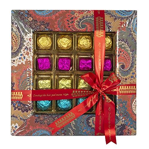 Feastive Celebrations Feastive Celebrations Bikanervala Chocolate Pralines Tray (16 Pcs) with a set of 5 Blessed Rakhis , a pair of Ganesha Soan, Pooja Rakhi, Kesar(branded) and Chawal. Complimentary Surprise gift for your