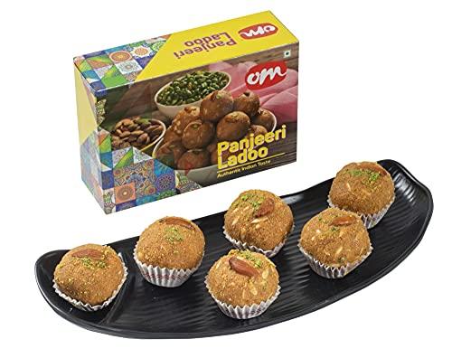 Feastive Celebrations Feastive Celebrations Om Sweets Panjeeri Laddu (250 grams) with Mayur Dhwaj Rakhi, a pair of Ganesha Soan, Pooja Rakhi, Kesar(branded) and Chawal | Surprise Gift Inside