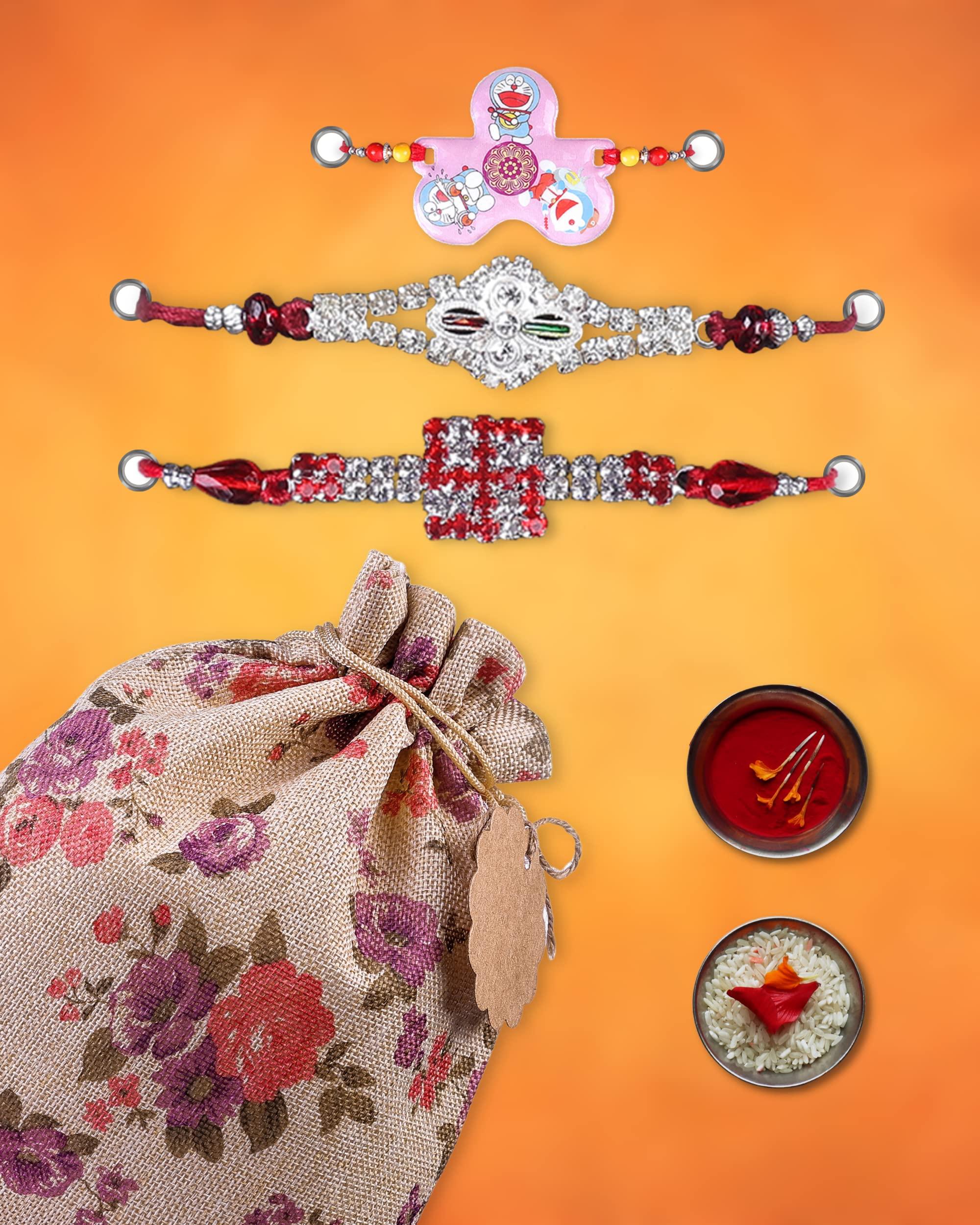 Kadambri Teas Kadambri Teas Rakhi Gift Hamper for Brother, Bhabhi and 1 Kid || Luxury Rakshabandhan Gift Set || Gift Box Contains: 1 Premium Darjeeling Tea (50 gm), 1 Pure Assam Chai (100gm), 3 Rakhis, Roli Chawal in Floral Linen Jute Bag (1 Kids & 2 Adults Rakhis