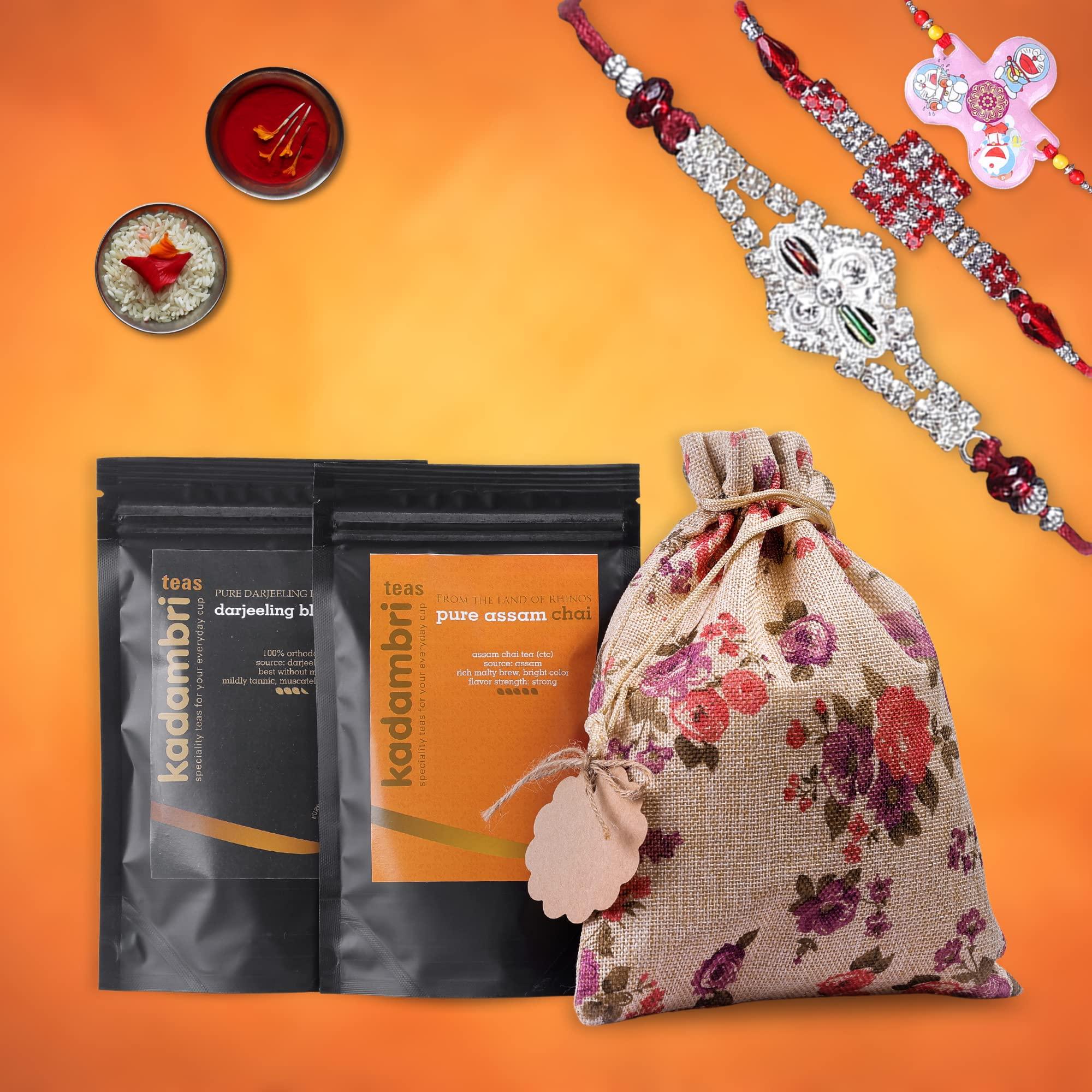 Kadambri Teas Kadambri Teas Rakhi Gift Hamper for Brother, Bhabhi and 1 Kid || Luxury Rakshabandhan Gift Set || Gift Box Contains: 1 Premium Darjeeling Tea (50 gm), 1 Pure Assam Chai (100gm), 3 Rakhis, Roli Chawal in Floral Linen Jute Bag (1 Kids & 2 Adults Rakhis
